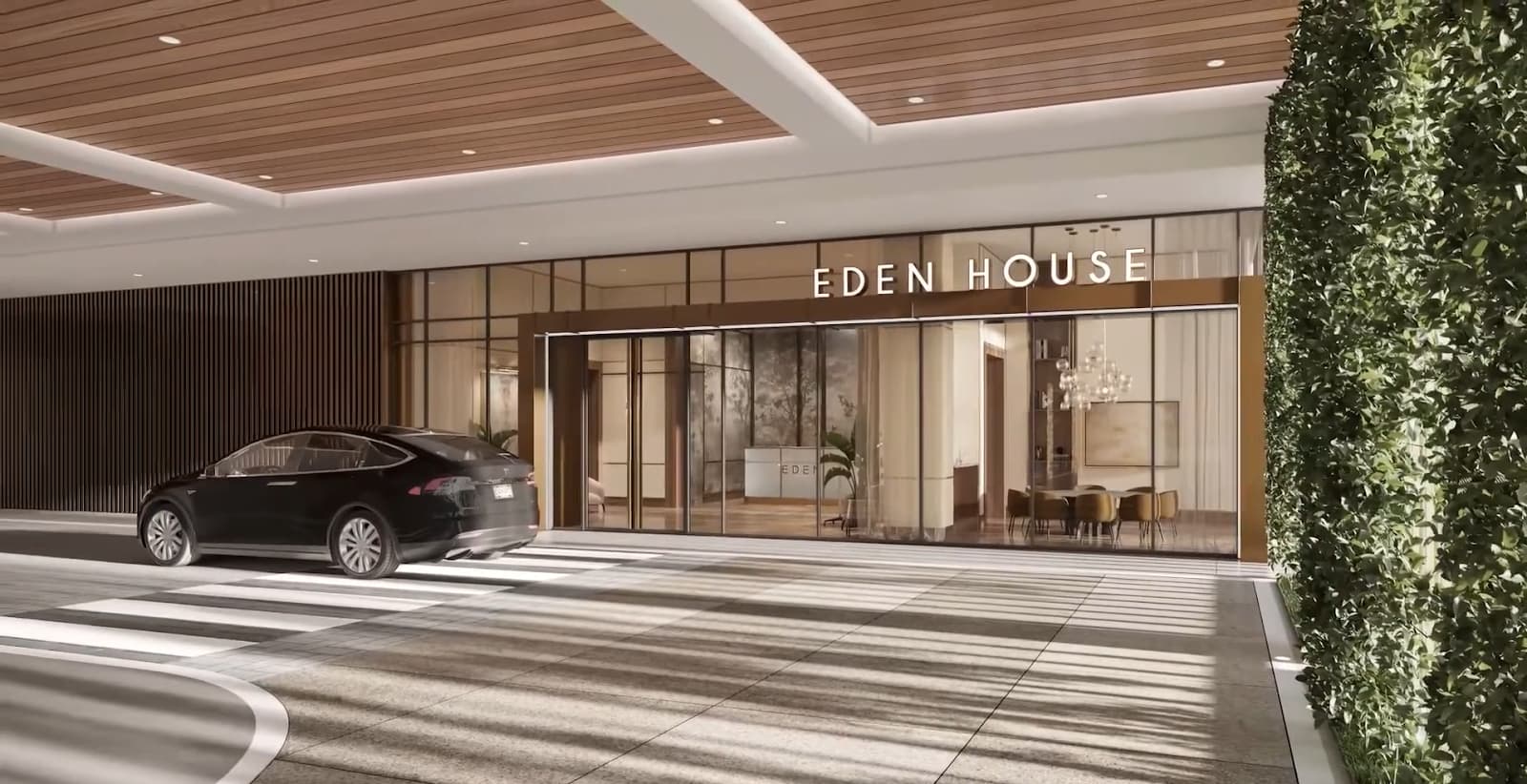 A luxury building entrance labeled "EDEN HOUSE" with a car out front