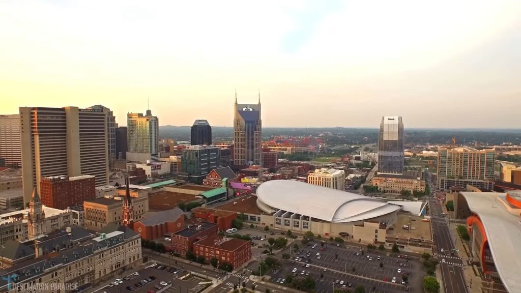 Aerial view of downtown Nashville at dusk with prominent buildings