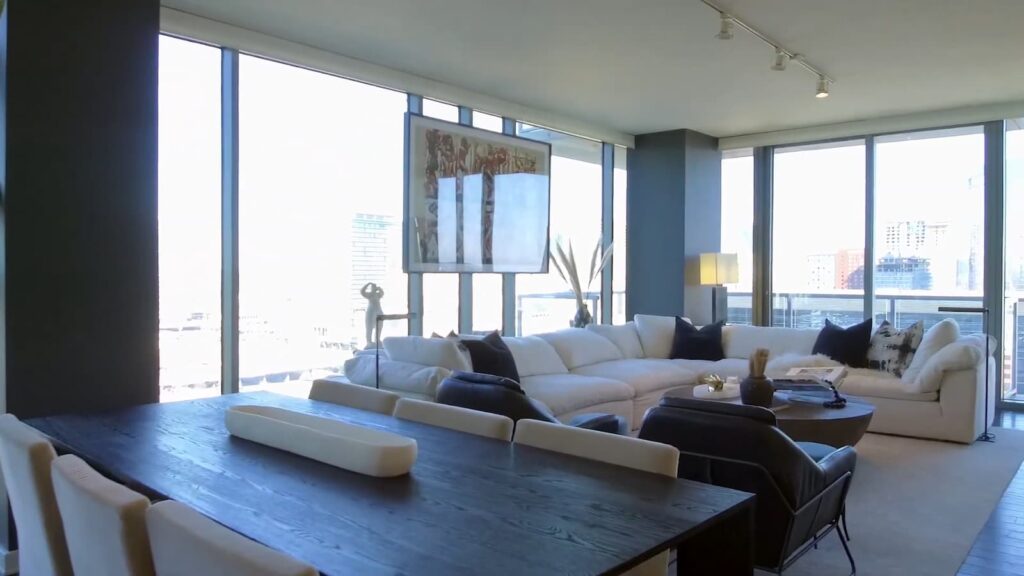 Contemporary living room with large windows and city view