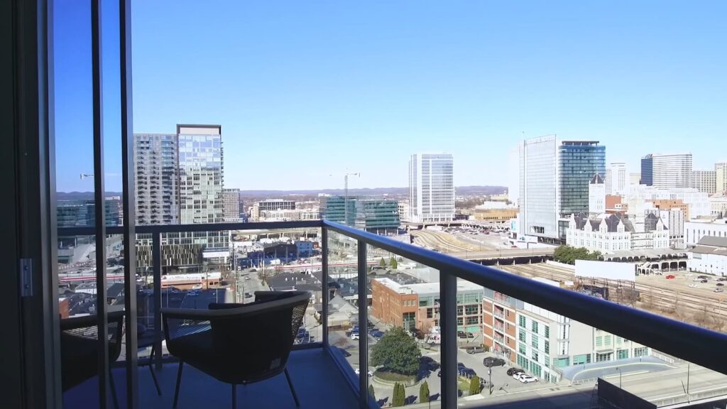 Balcony view of a modern cityscape with clear skies